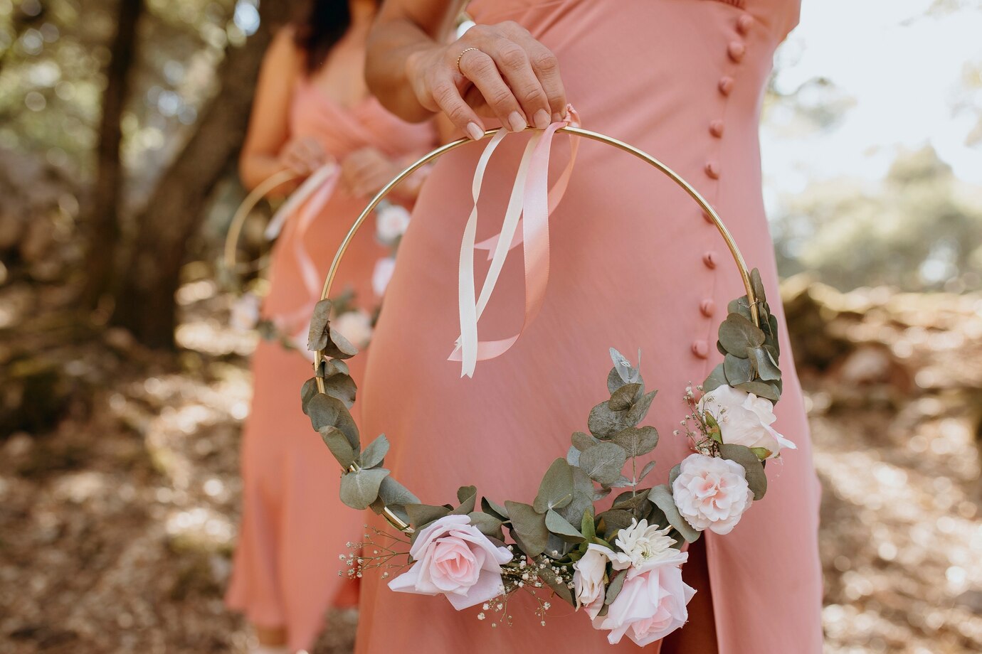 Beautiful bridesmaid holding a floral bouquet