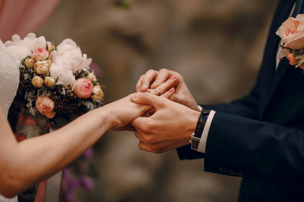 Groom putting ring