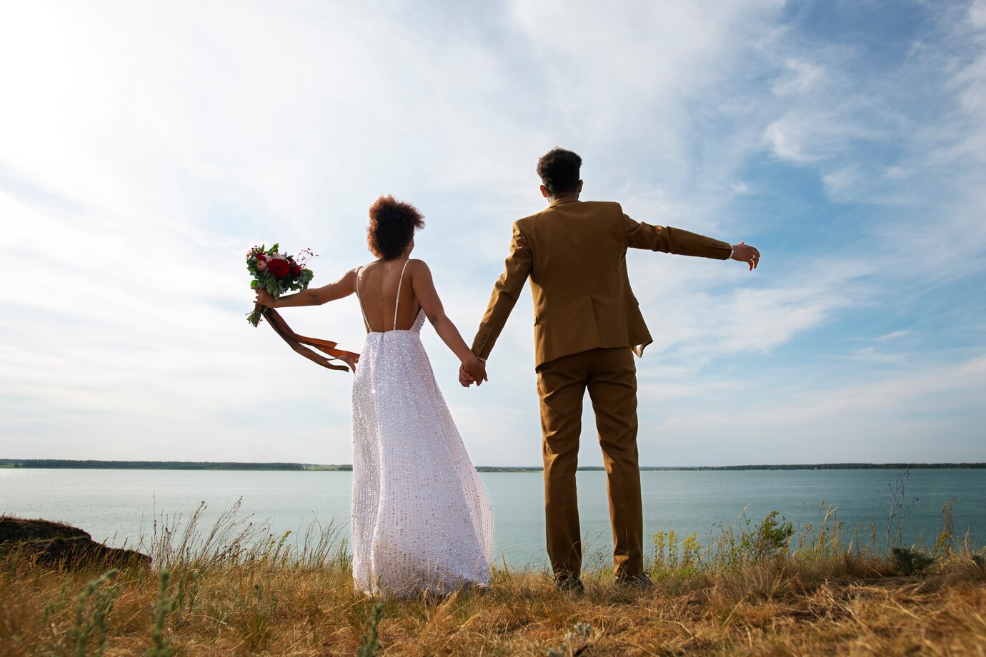 bride and groom posing outdoors